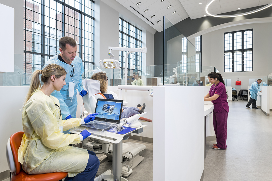 dentists at Penn Dental working on computer