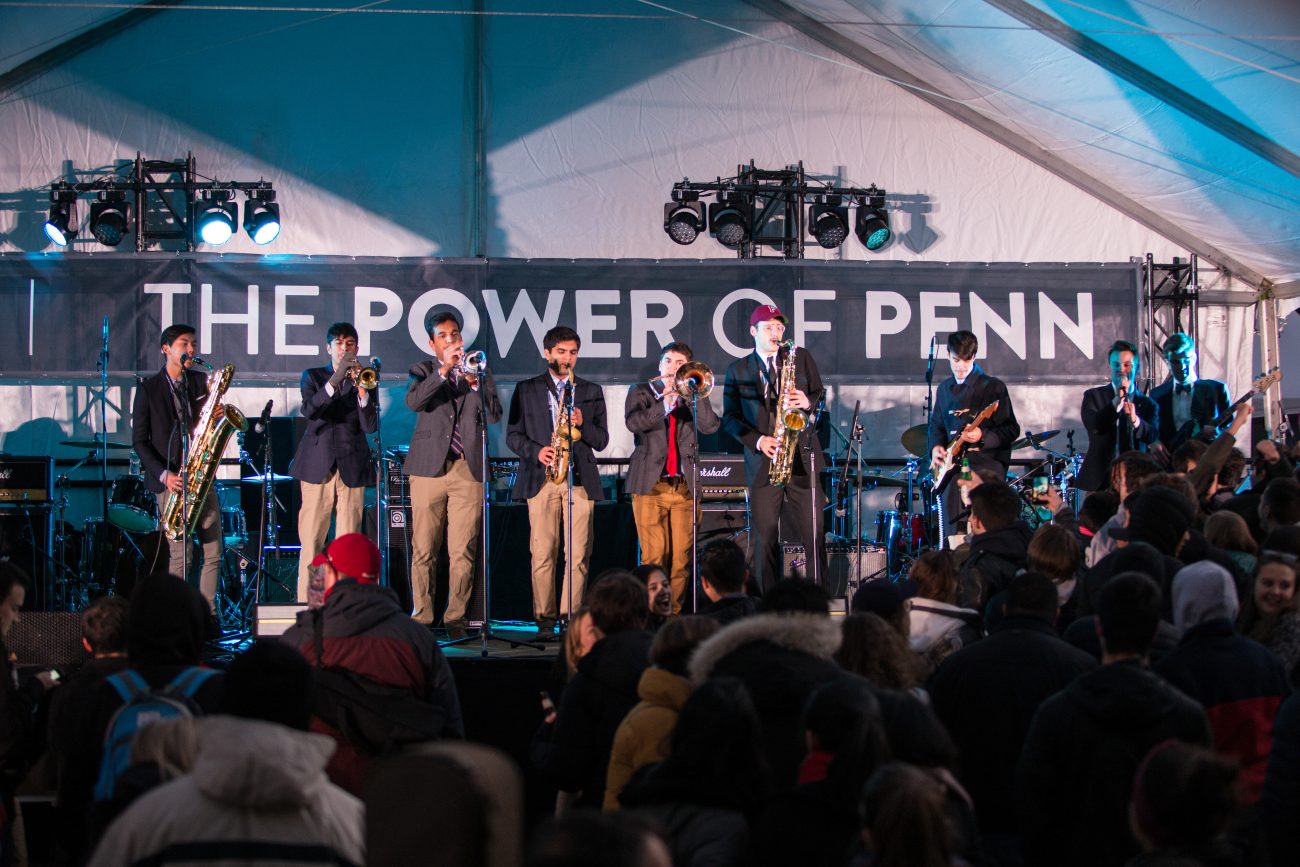 students performing playing musical instruments at the penn palooza