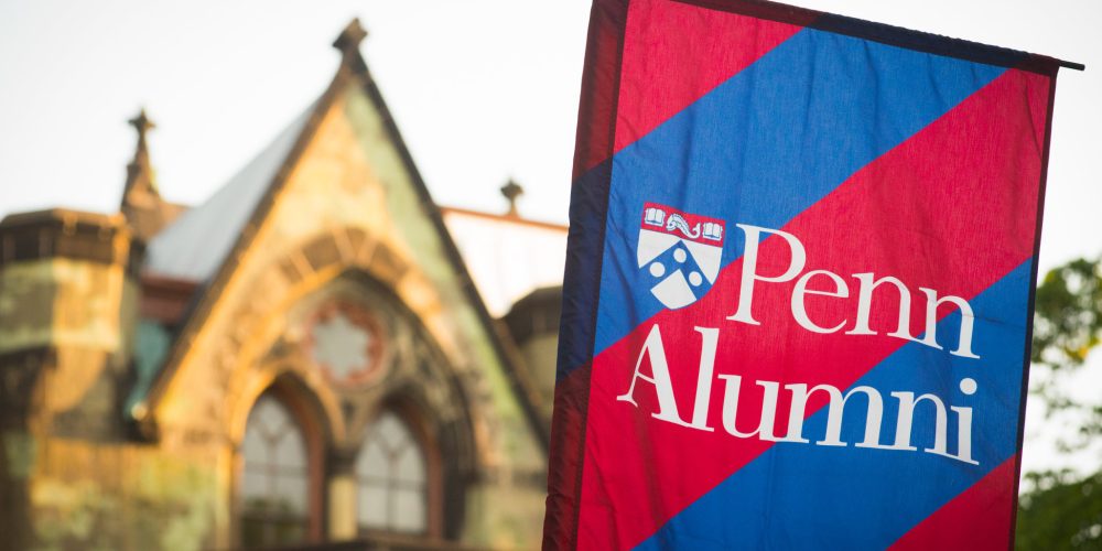 Penn Alumni flag in front of College Hall