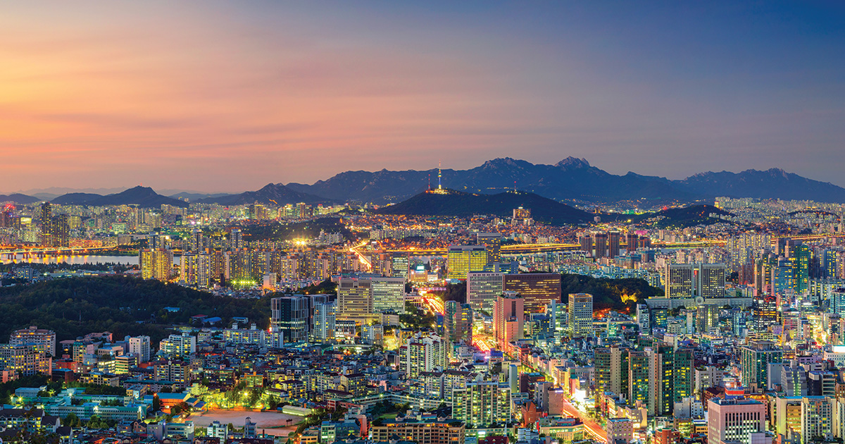 Panoramic cityscape image of Seoul downtown during summer sunset.