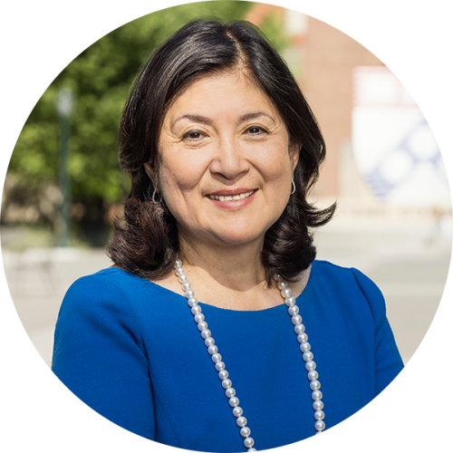 A portrait of Bonnie Miao Bandeen, C’80, WG’85, PAR’16, PAR’22, Chair, Trustee Development Committee, photographed on Penn Common at the University of Pennsylvania.