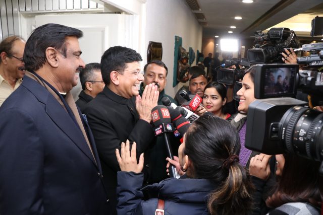 man being interviewed by tv stations