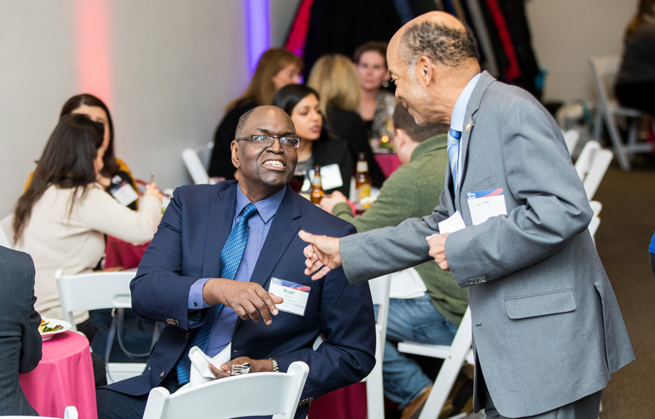 two men about to shake hands