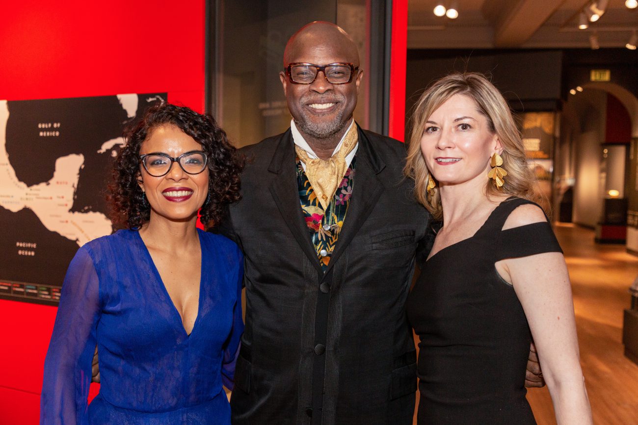 three attendees at the golden gala