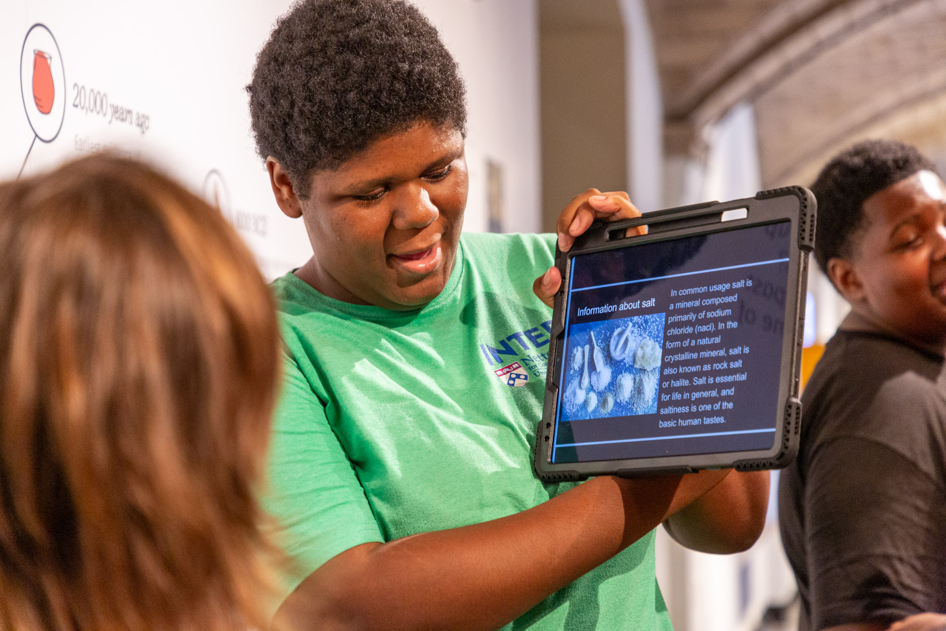 A student speaks to a Penn Museum visitor about salt during a pop-up tour of the Penn Museum's Ancient Food and Flavor exhibition