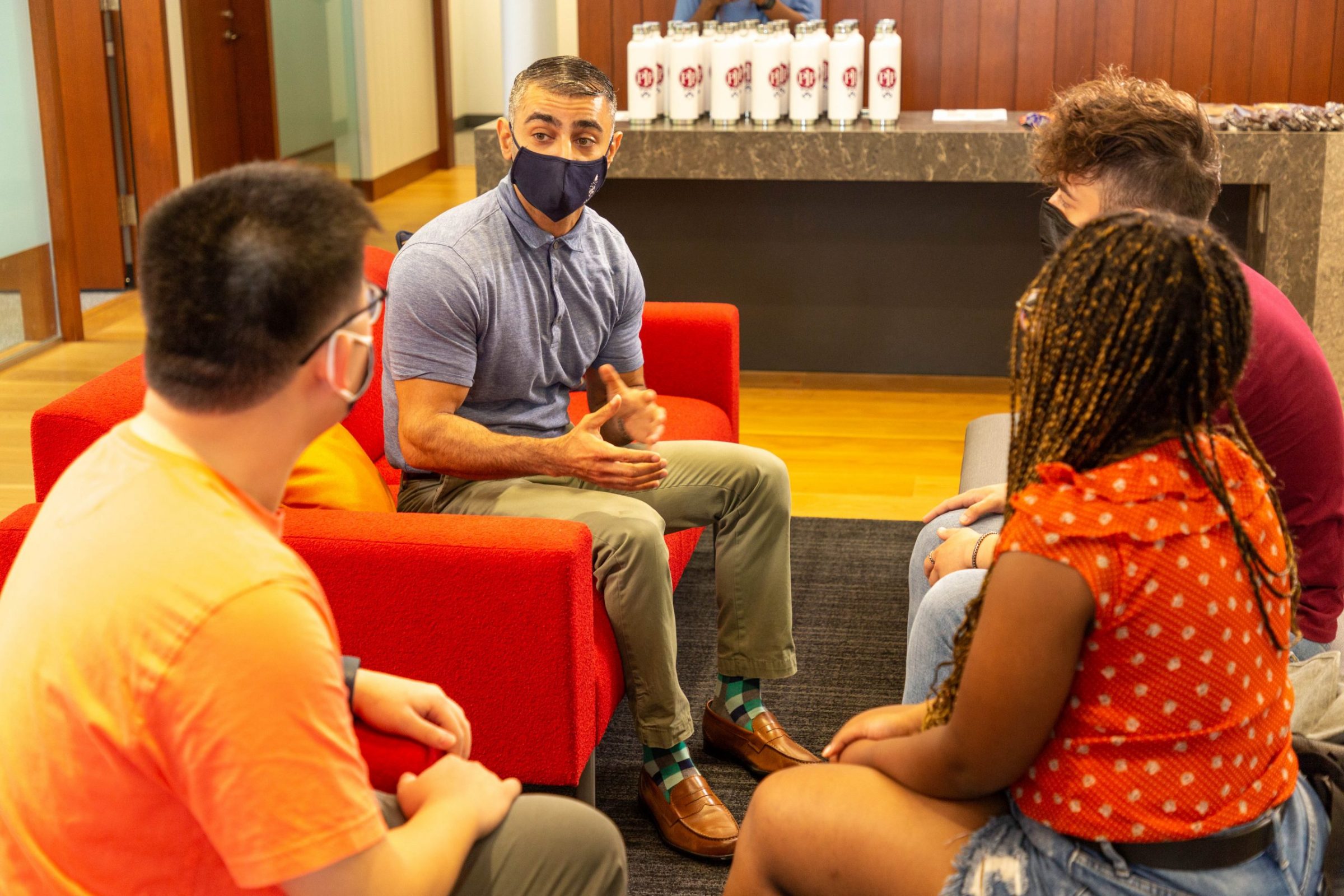 Hatif Alavi, inaugural Associate Director of Penn First Plus, speaking with a group of students