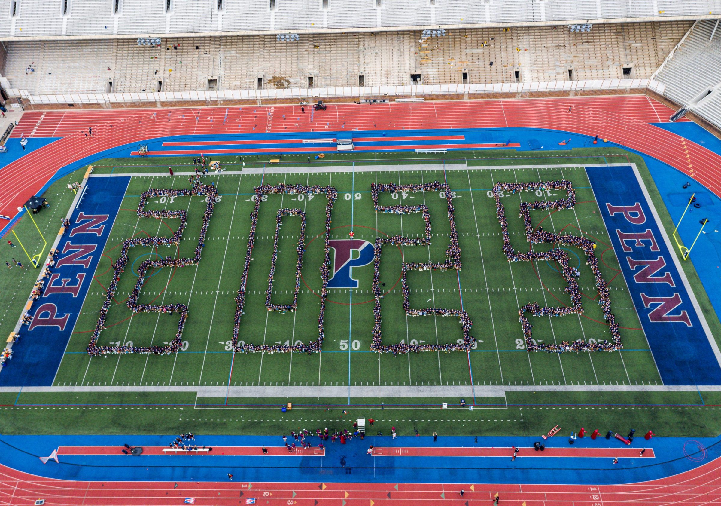 The Class of 2025 stands in formation spelling out 