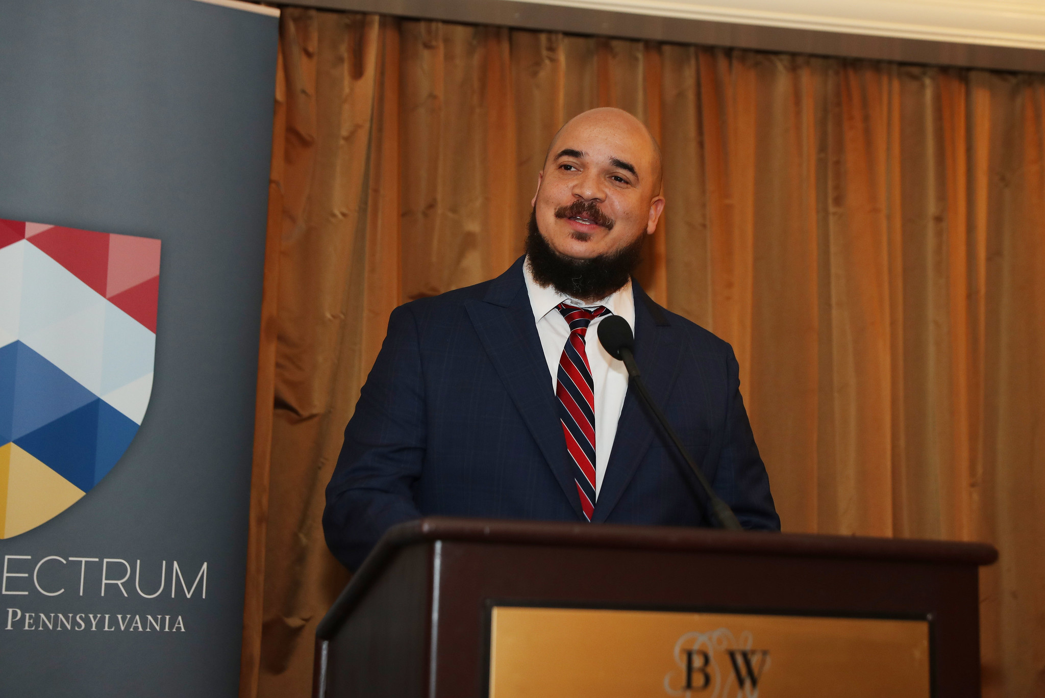 Chaz Howard, C'00, University Chaplain and Vice President for Social Equity & Community, addresses the crowd during a Penn Spectrum pre-reception.