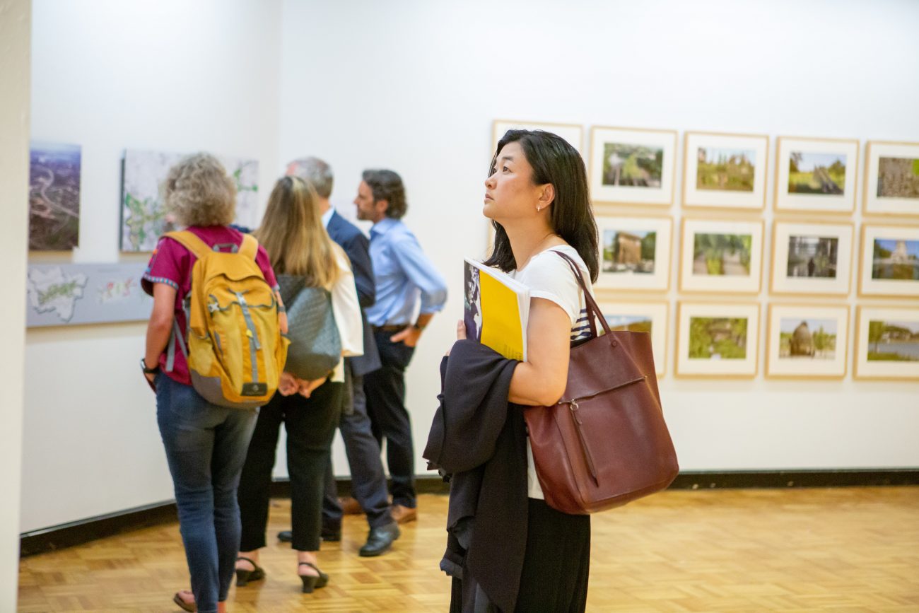 a woman admiring art in a museum