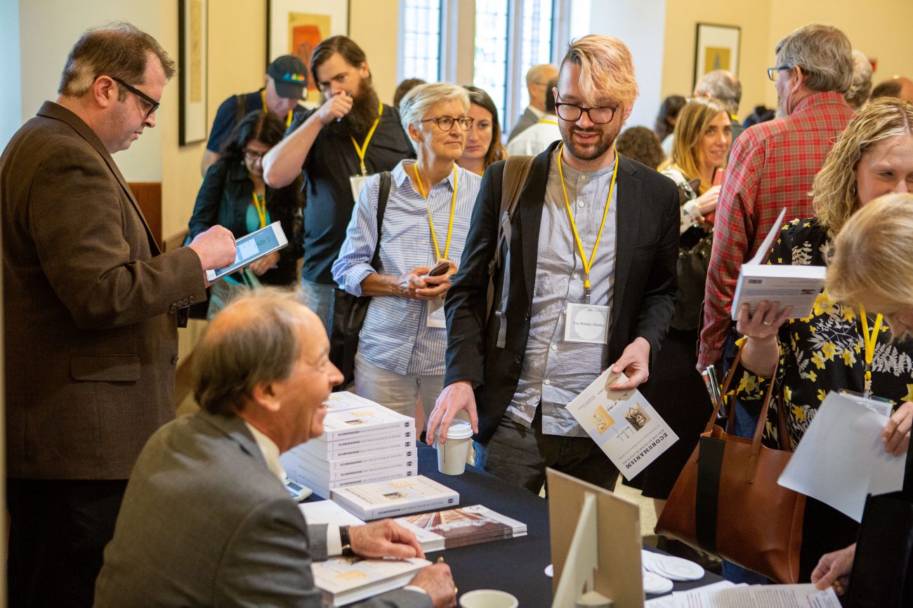 a group of people at a book signing