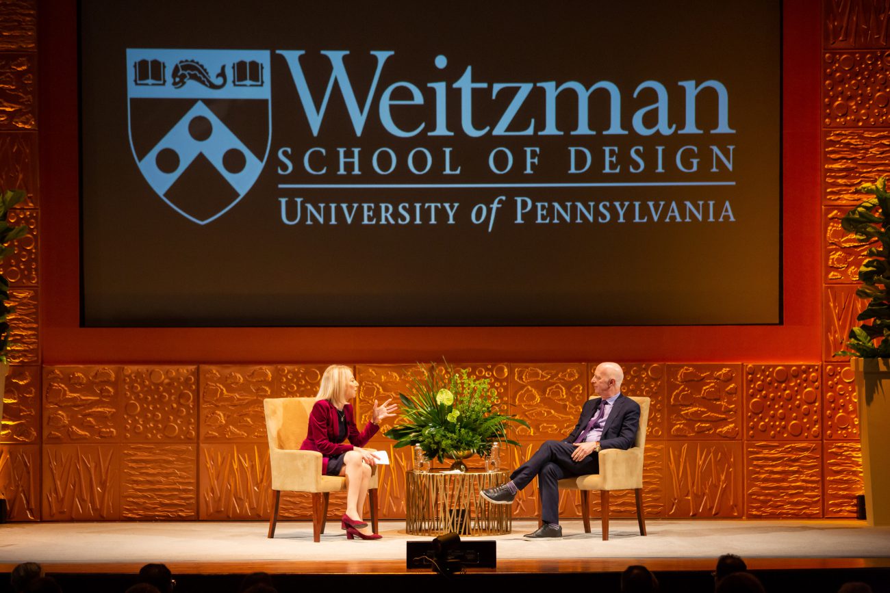 a discussion on stage between president of University of Pennsylvania and Paul Goldberger