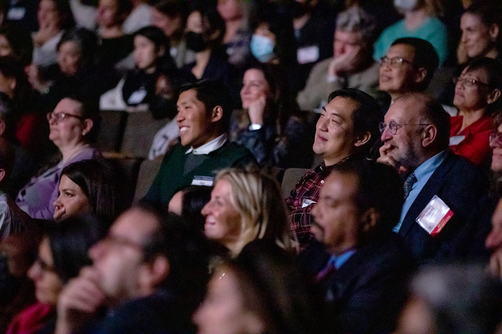 An audience of Penn alumni, parents, and friends watch the program during a Penn Forward event.