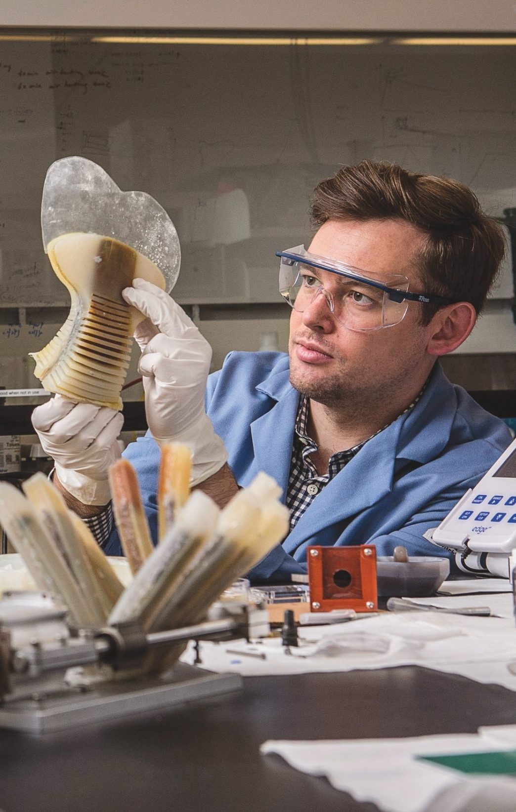 Researcher working with prototypes in lab