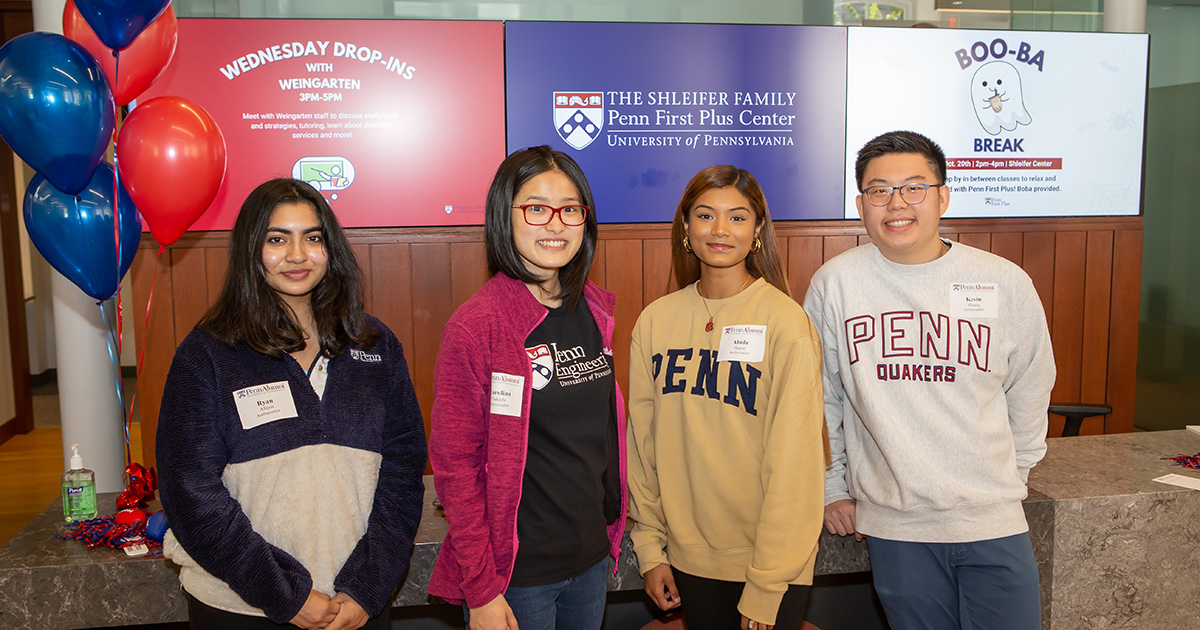 Four Penn students stand together at the Shleifer Penn First Plus Center at the University of Pennsylvania.