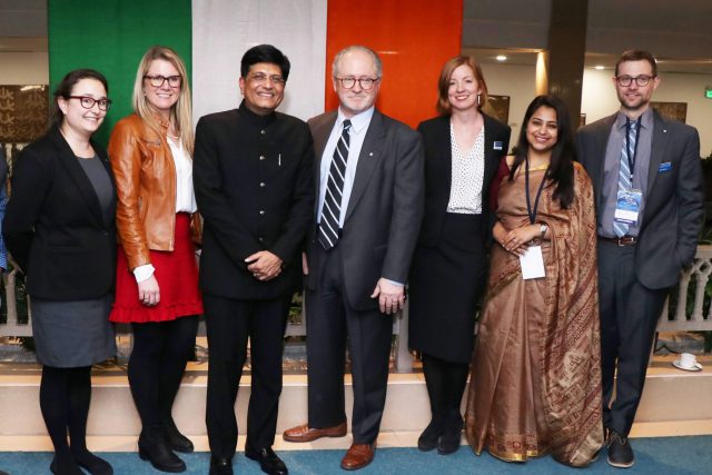 The Penn team gathers with the minister following the event.