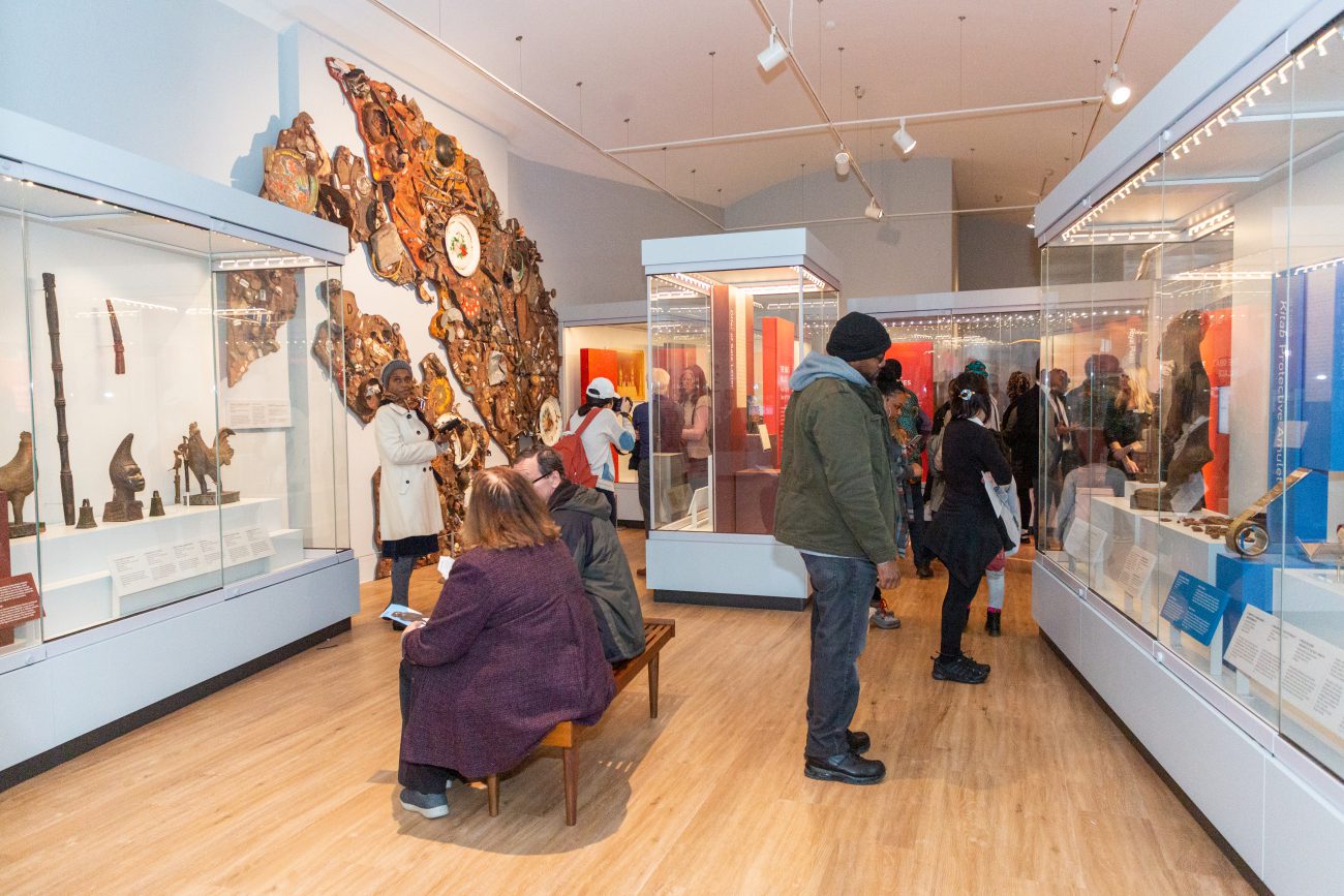 Visitors browse some of the hundreds of objects on display in the Africa Galleries.