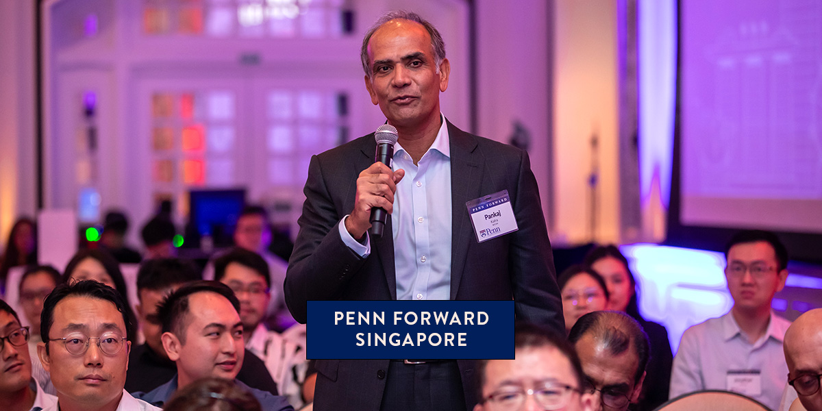 A Penn alumnus in the audience asks a question during Penn Forward Singapore