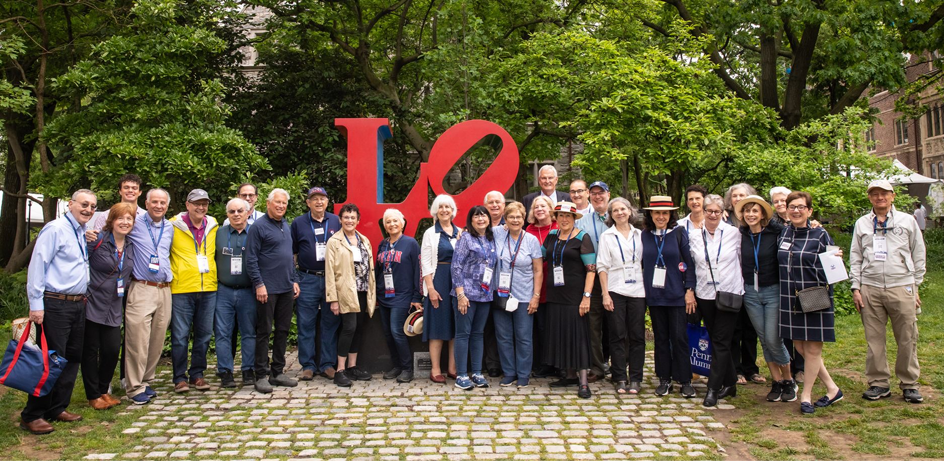 alumni in front of LOVE statue