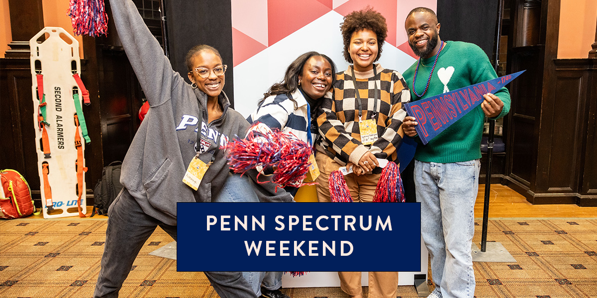 Four attendees at Penn Spectrum weekend smile for the camera