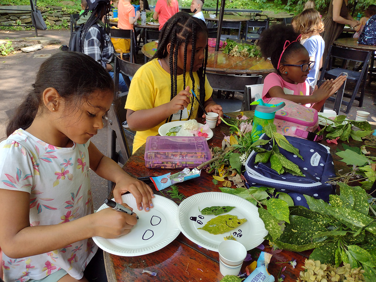 children making art with plants