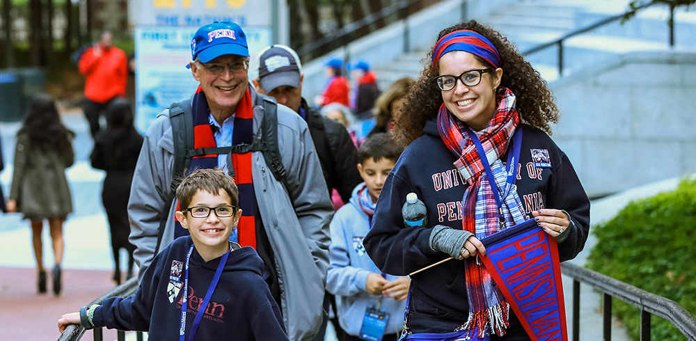 penn alumni and their children walking together