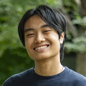 Portrait of University of Pennsylvania student Andrew Luong smiling outdoors.