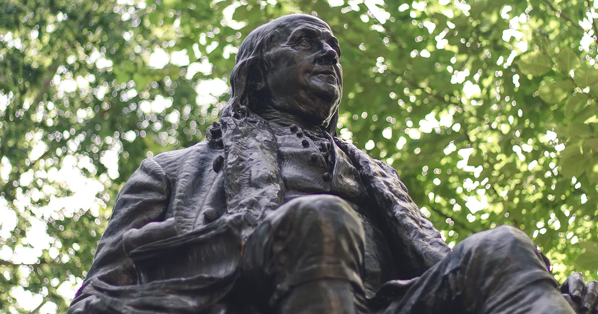 Ben Franklin statue representing academic heritage and interdisciplinary studies at Penn.