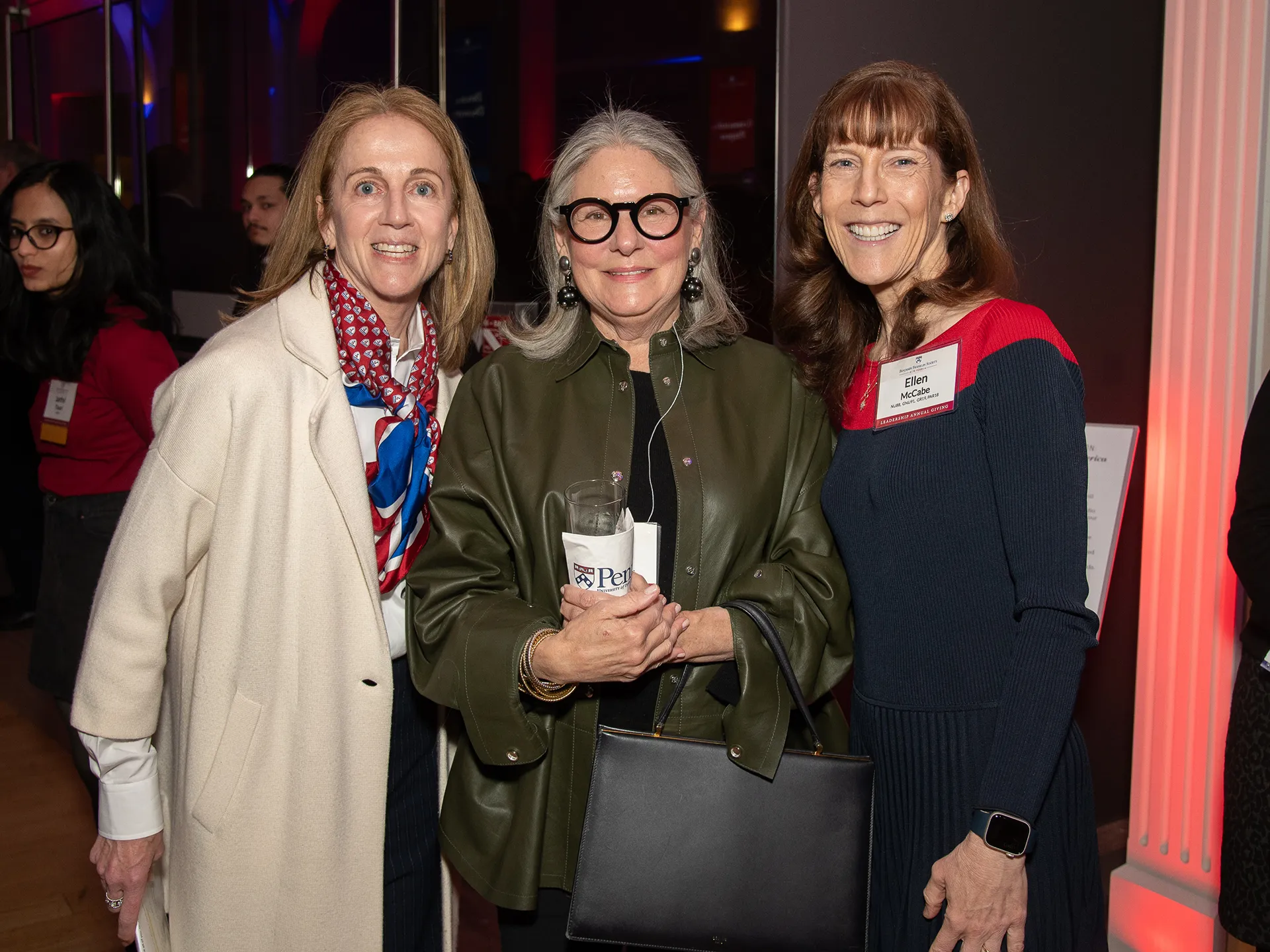Three Benjamin Franklin Society members smile for a group photo at the Spring Reception, celebrating 70 years of leadership annual giving.