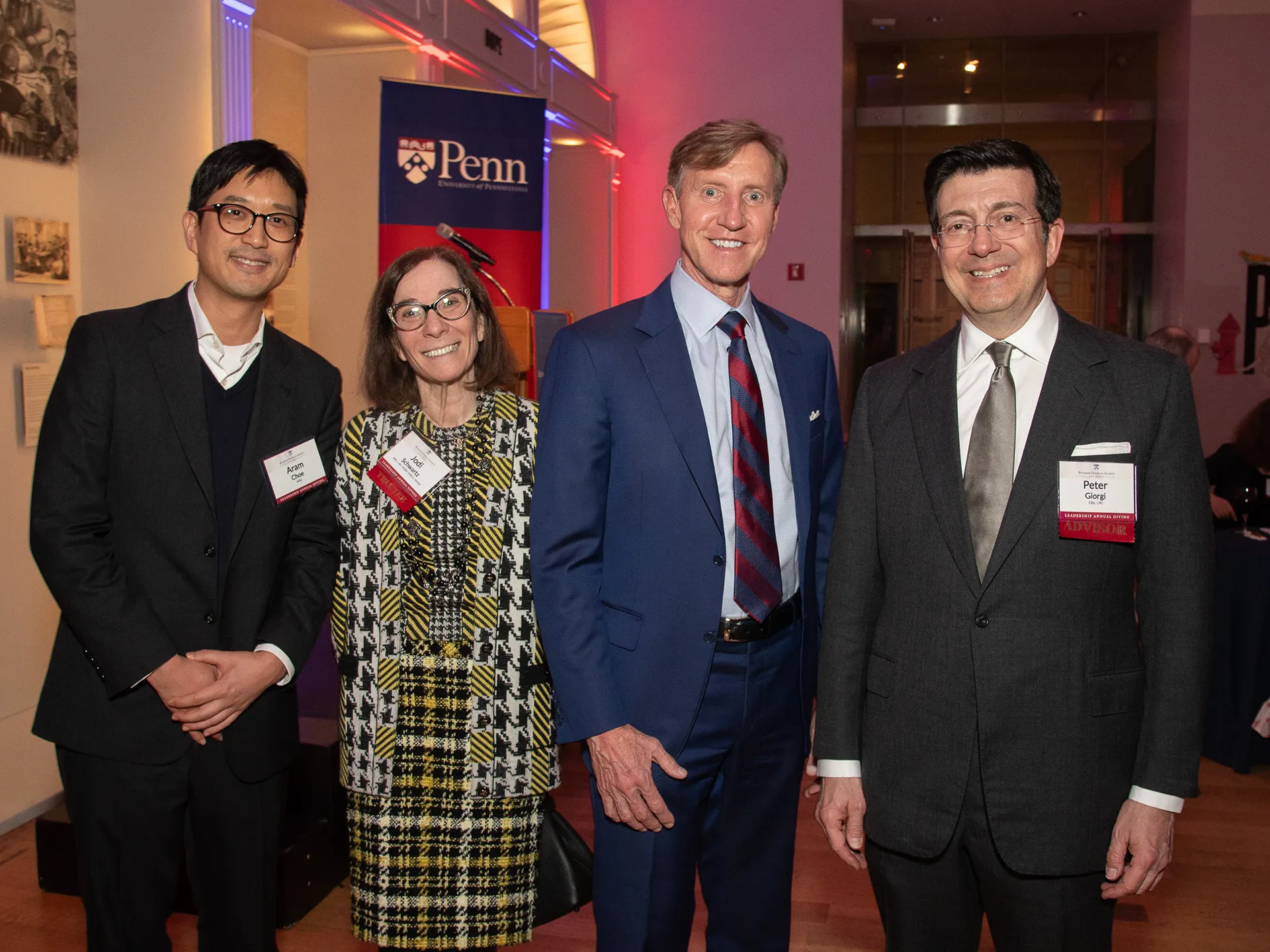 Four attendees, including Penn President J. Larry Jameson, smile for a group photo at the BFS 70th anniversary celebration in New York City.