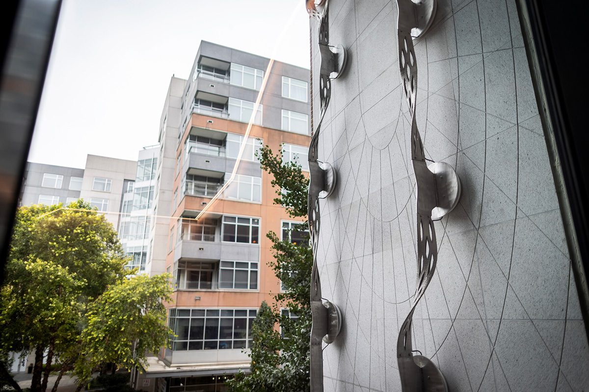 A metal artwork on the exterior of a building.