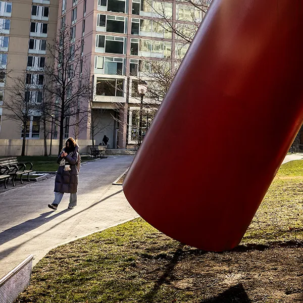 Winter sunlight casts shadows across the Covenant sculpture and surrounding path at Penn.