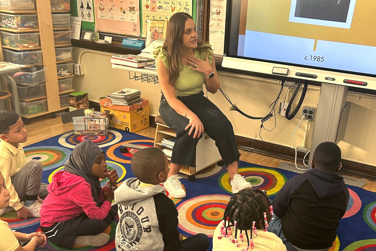 Danielle Machado, GEd’24, speaks to young students in a classroom