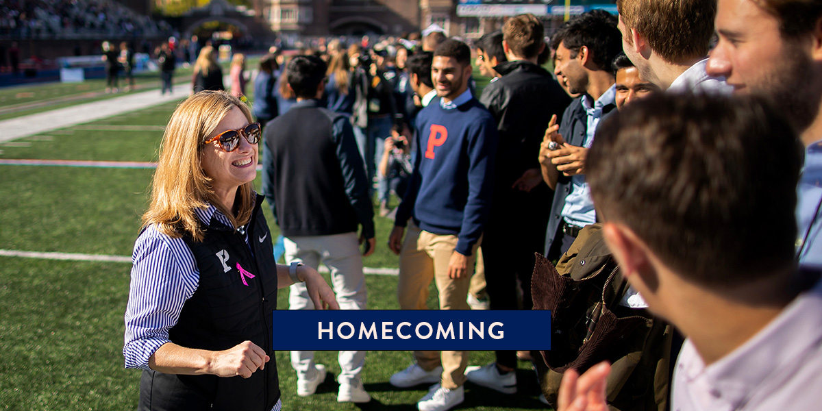 President Magill met with student athletes on Franklin Field during the 2022 Homecomung football game.
