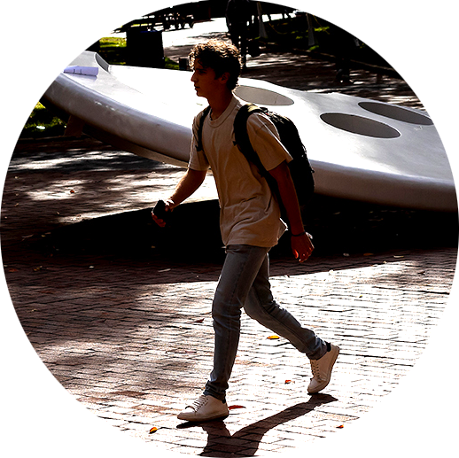 A student walks in front of the Split Button statue at the University of Pennsylvania