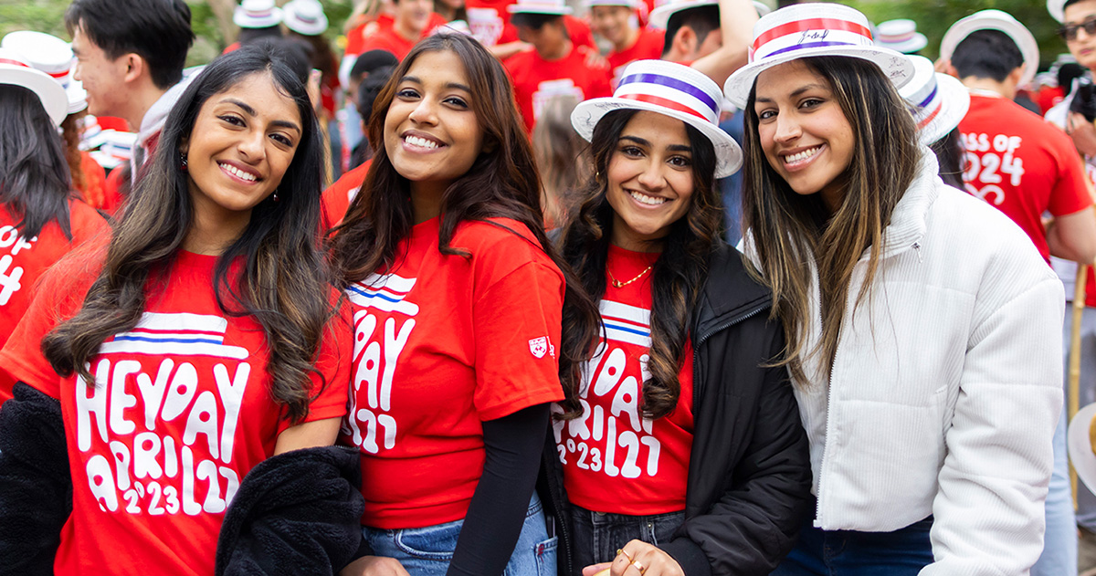 Four students stand together during Hey Day in 2023