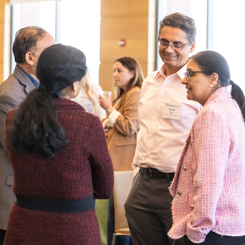 Members of the Penn Parents Council chat before one of the group's meeting
