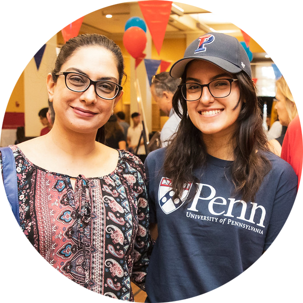 A Penn student and her mother stand together in Houston Hall