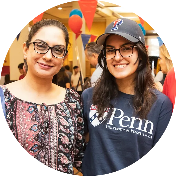 A Penn student and her mother stand together in Houston Hall.