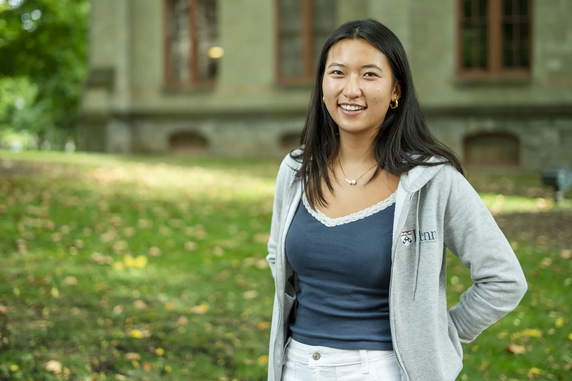 University of Pennsylvania student Ashley Tang smiling outside College Hall.