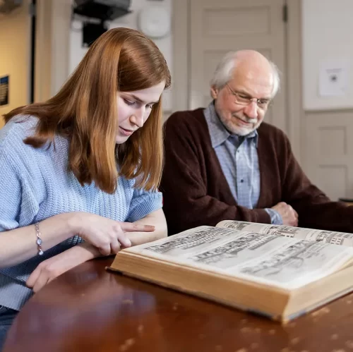 Penn student and professor explore a rare volume together, reflecting the research opportunities and faculty engagement supported by The Penn Fund.