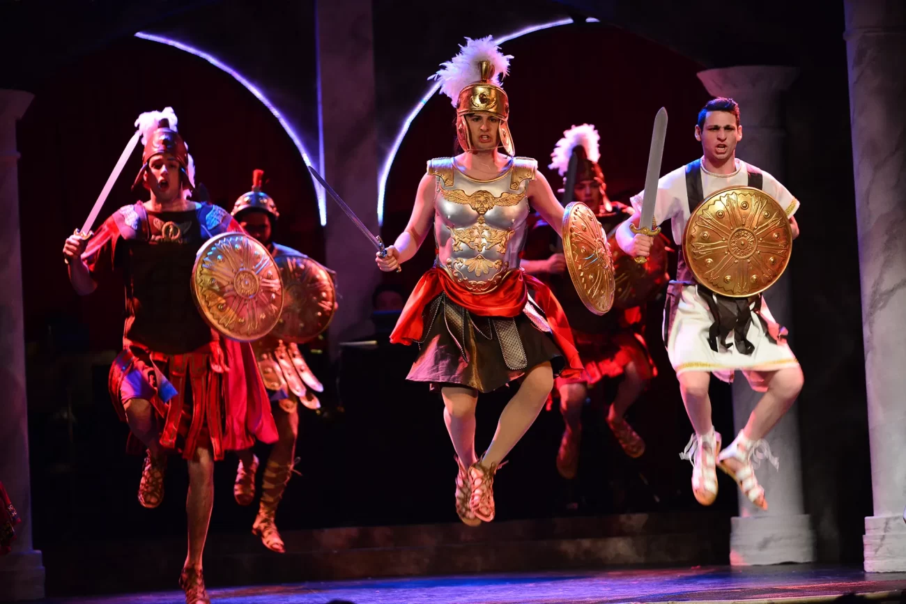 Performers from Penn’s Mask and Wig Club leap mid-scene in gladiator costumes during the show “No Place Like Rome.”