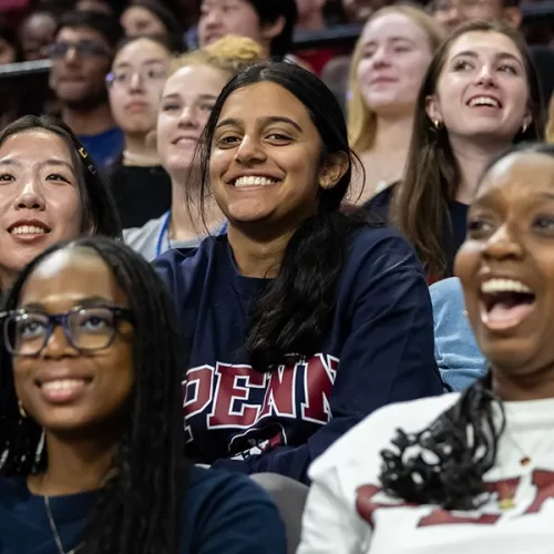 A group of Penn students smile and laugh together during New Student Orientation, capturing the excitement of beginning their college journey.