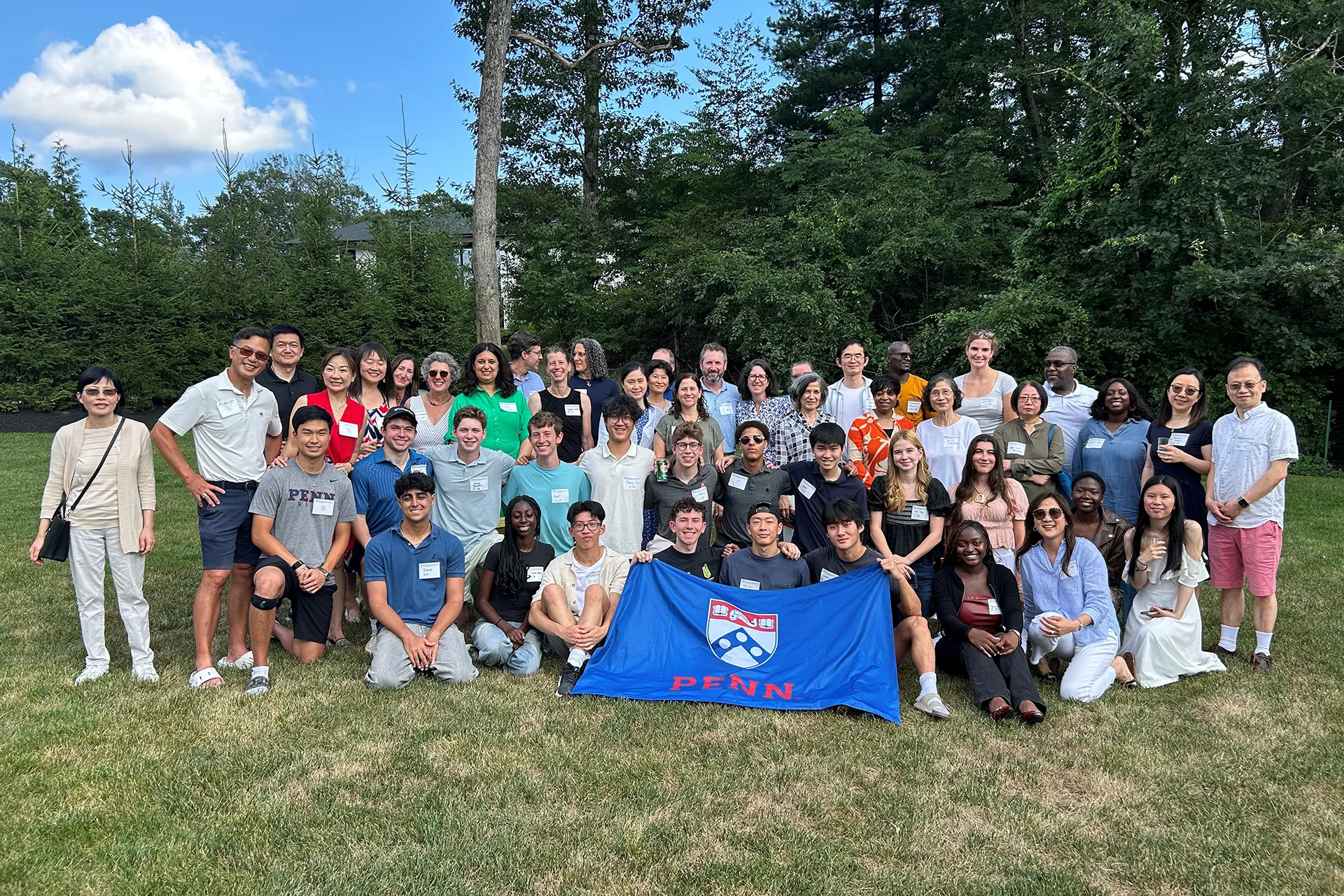 Incoming Penn students pose for a group photo together during a welcome reception in Boston.