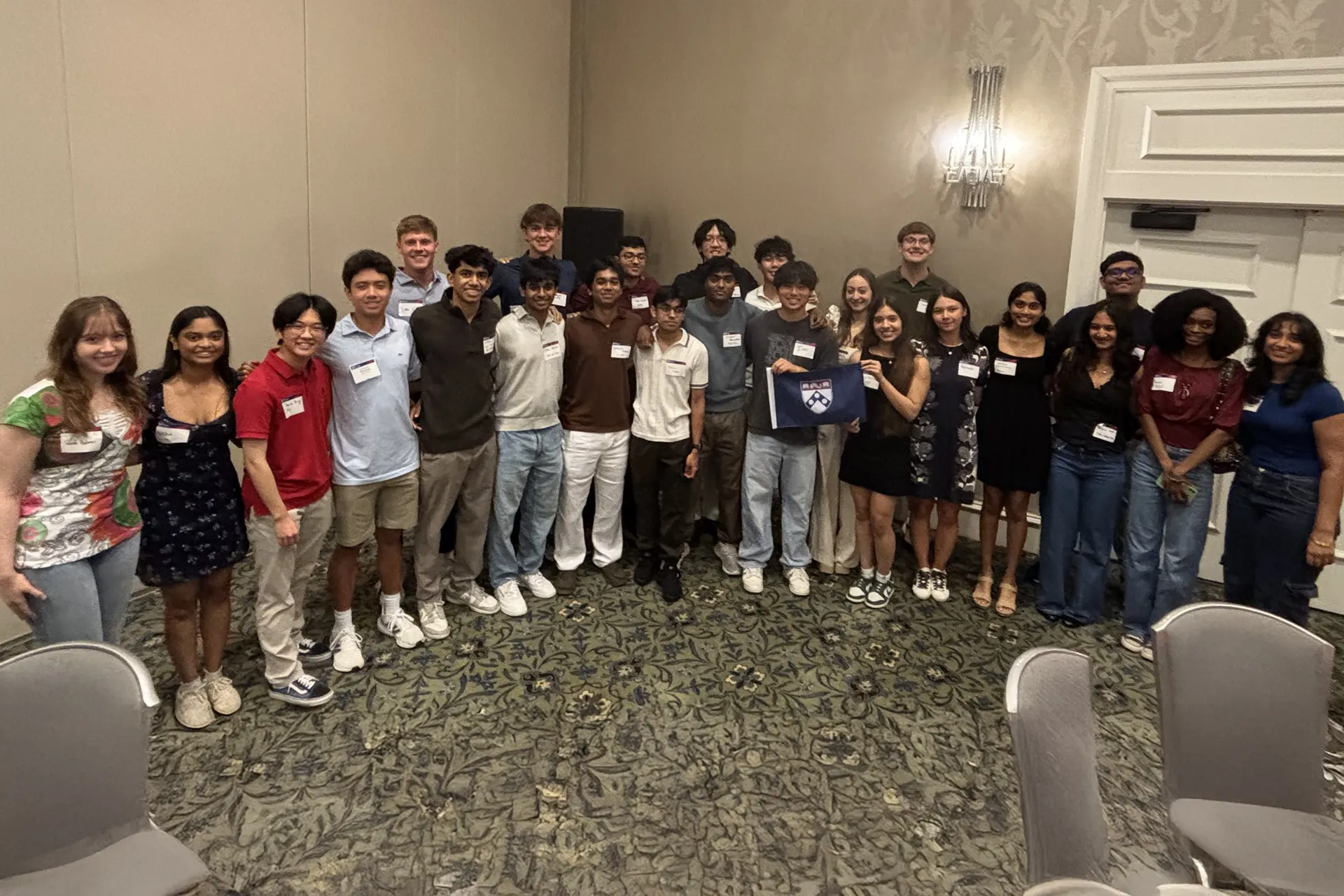 Incoming Penn students pose for a group photo together during a welcome reception in Dallas.