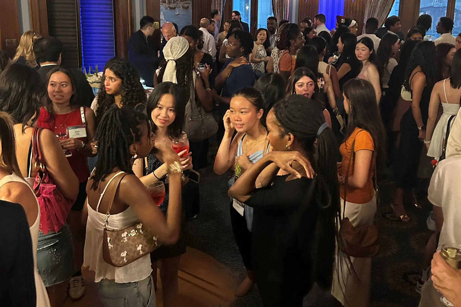 Incoming Penn students mingle and chat during a welcome reception in New York.
