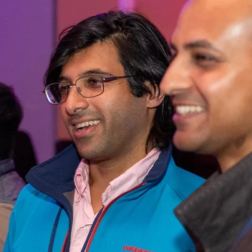 Two alumni laugh and connect while celebrating their class’s reunion and fundraising success.