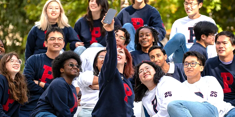 Penn students gather for a group selfie, celebrating campus life and the support systems made possible by The University Life Fund.