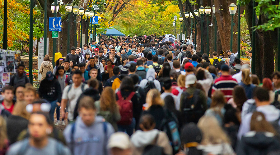 Hundreds of Penn students traverse Locust Walk at the University of Pennsylvania.
