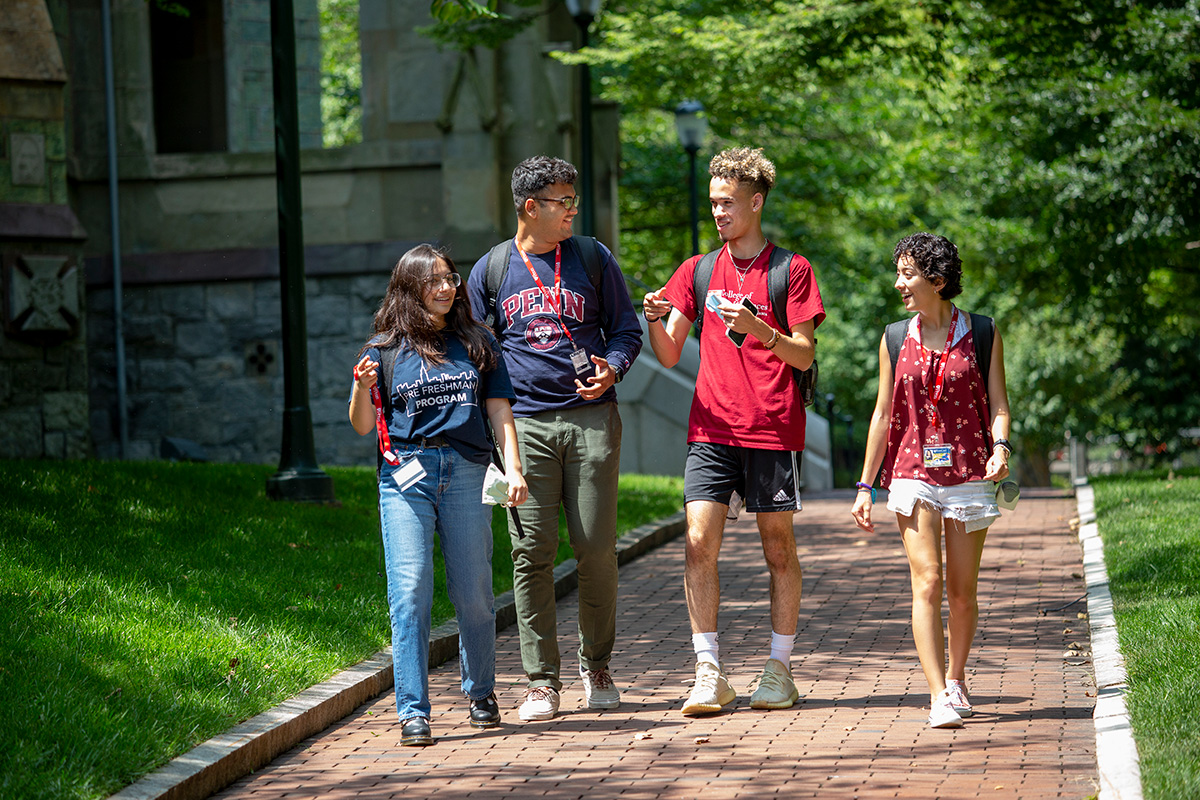 Students walk together on College Green.