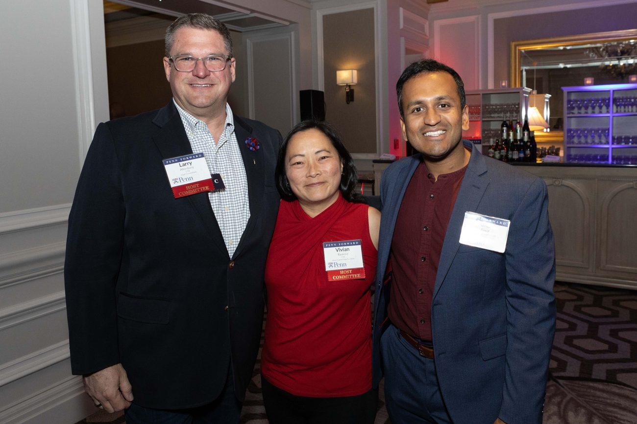 Three University of Pennsylvania alumni stand together at the 2023 Penn Forward event in Washington, D.C.